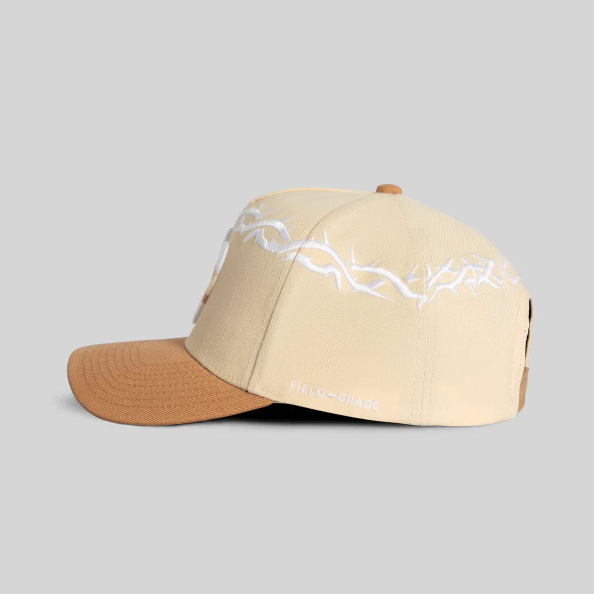 Field Grade Yankee Thorn Crown beige hat with a wide brim and decorative band, perfect for stylish outdoor wear.