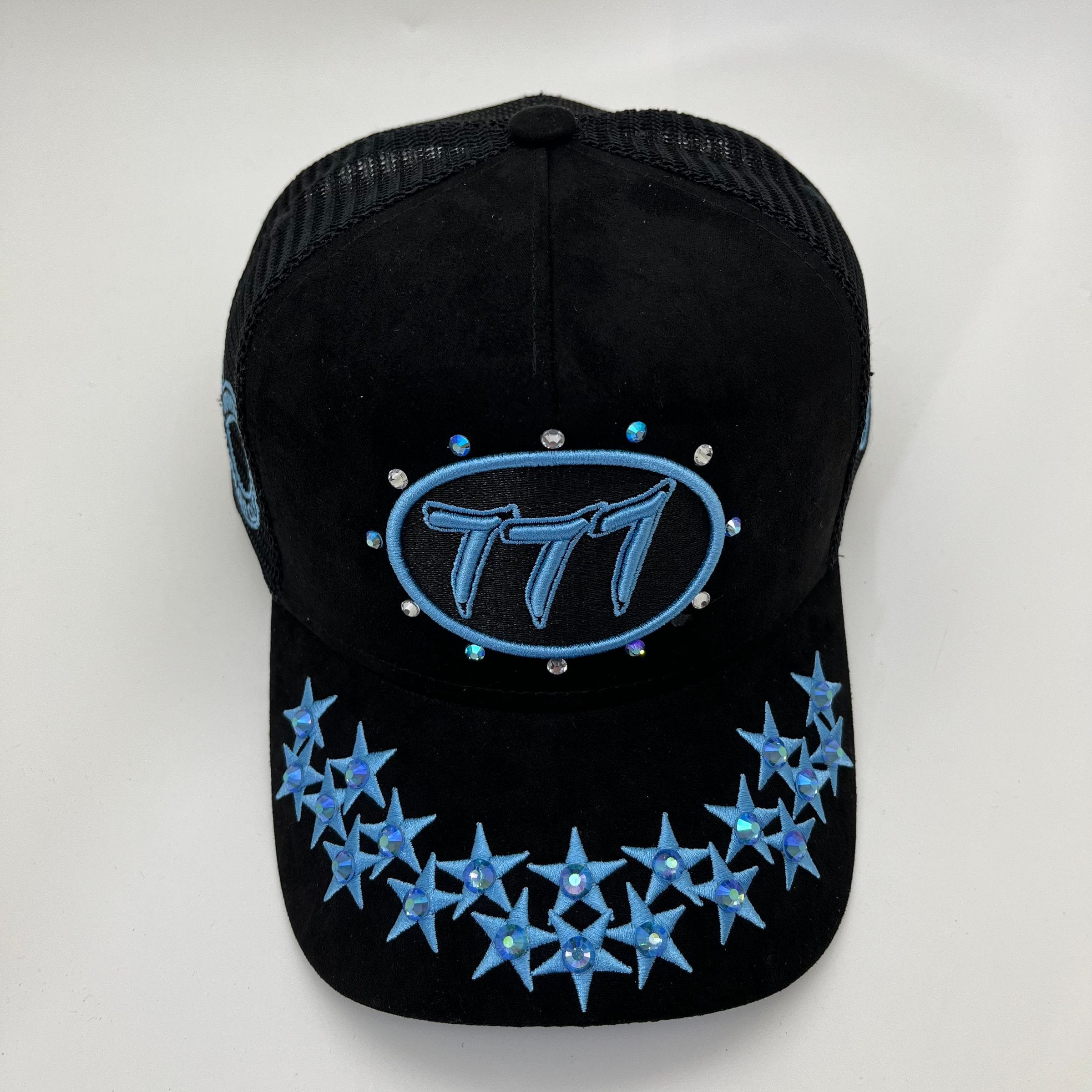 Hudson Outerwear V1 Diamond Suede Trucker Hat in black and university blue, featuring a classic trucker hat design.