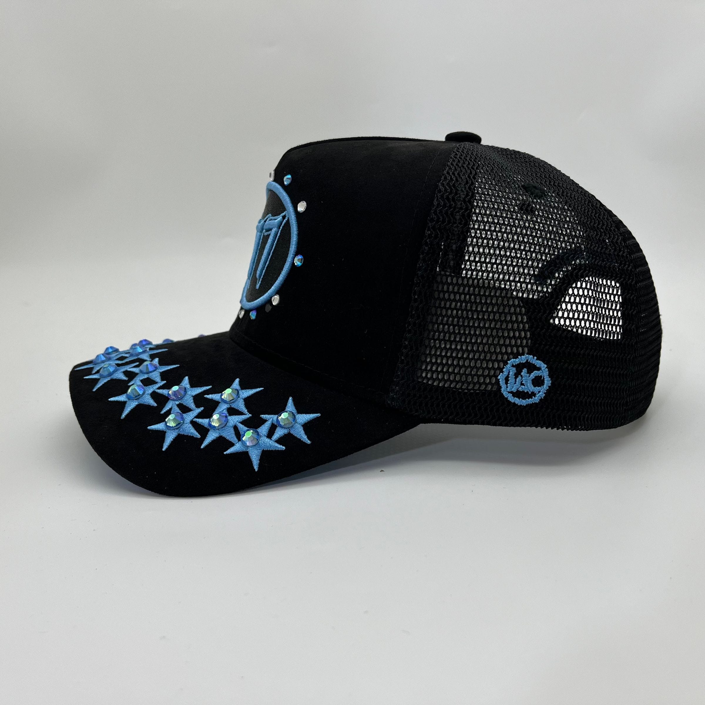 Black and university blue Hudson Outerwear V1 Diamond Suede Trucker Hat with mesh panels and curved brim.