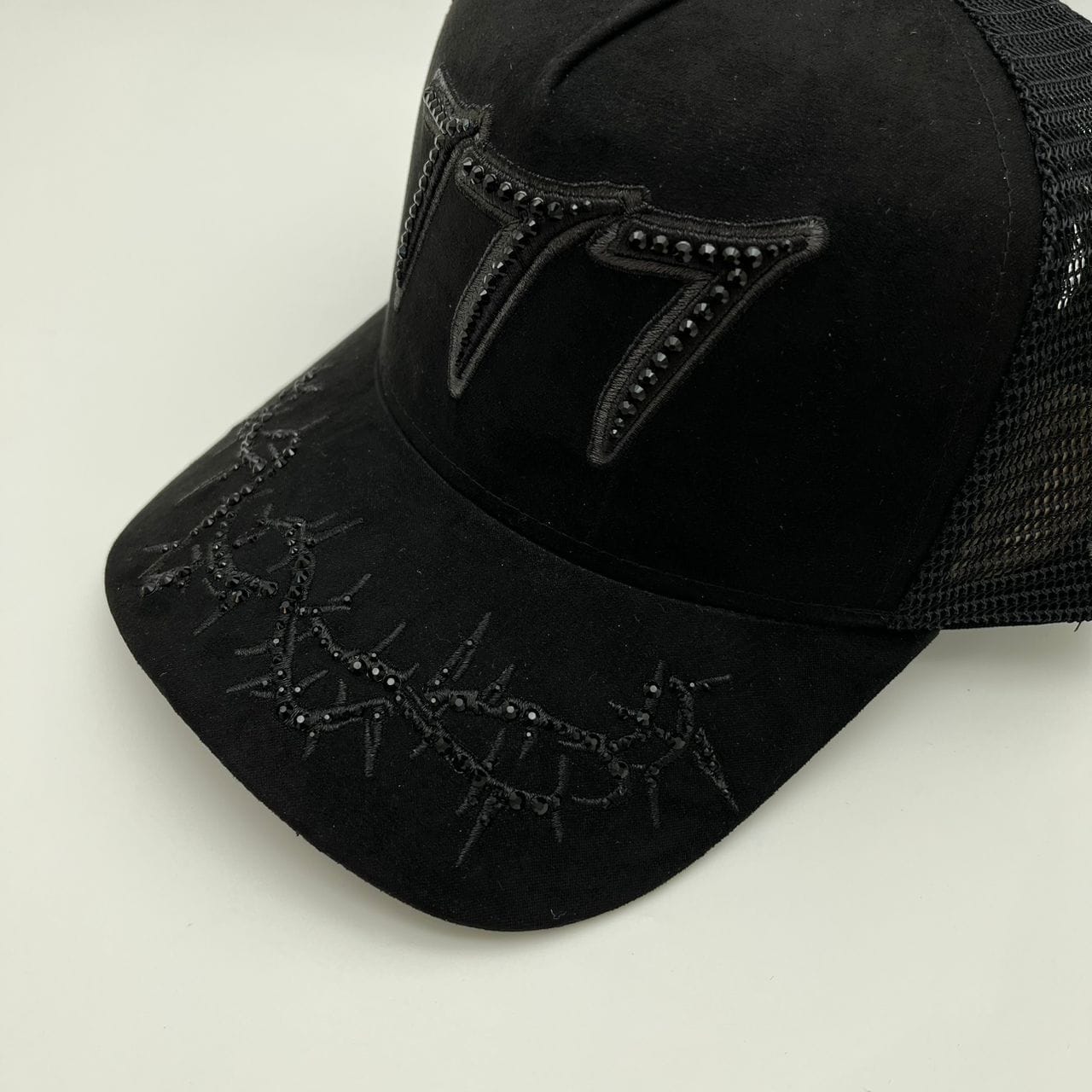 Black and black Hudson Outerwear V2 Diamond Suede Trucker Hat with mesh back and adjustable strap.