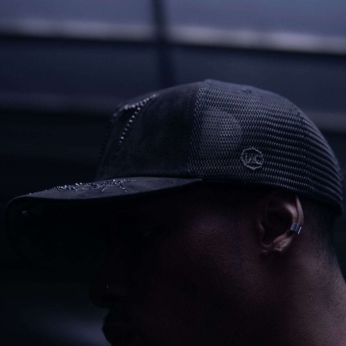 Hudson Outerwear V2 Diamond Suede Trucker Hat in black with mesh back and curved brim, stylish and comfortable for casual wear.