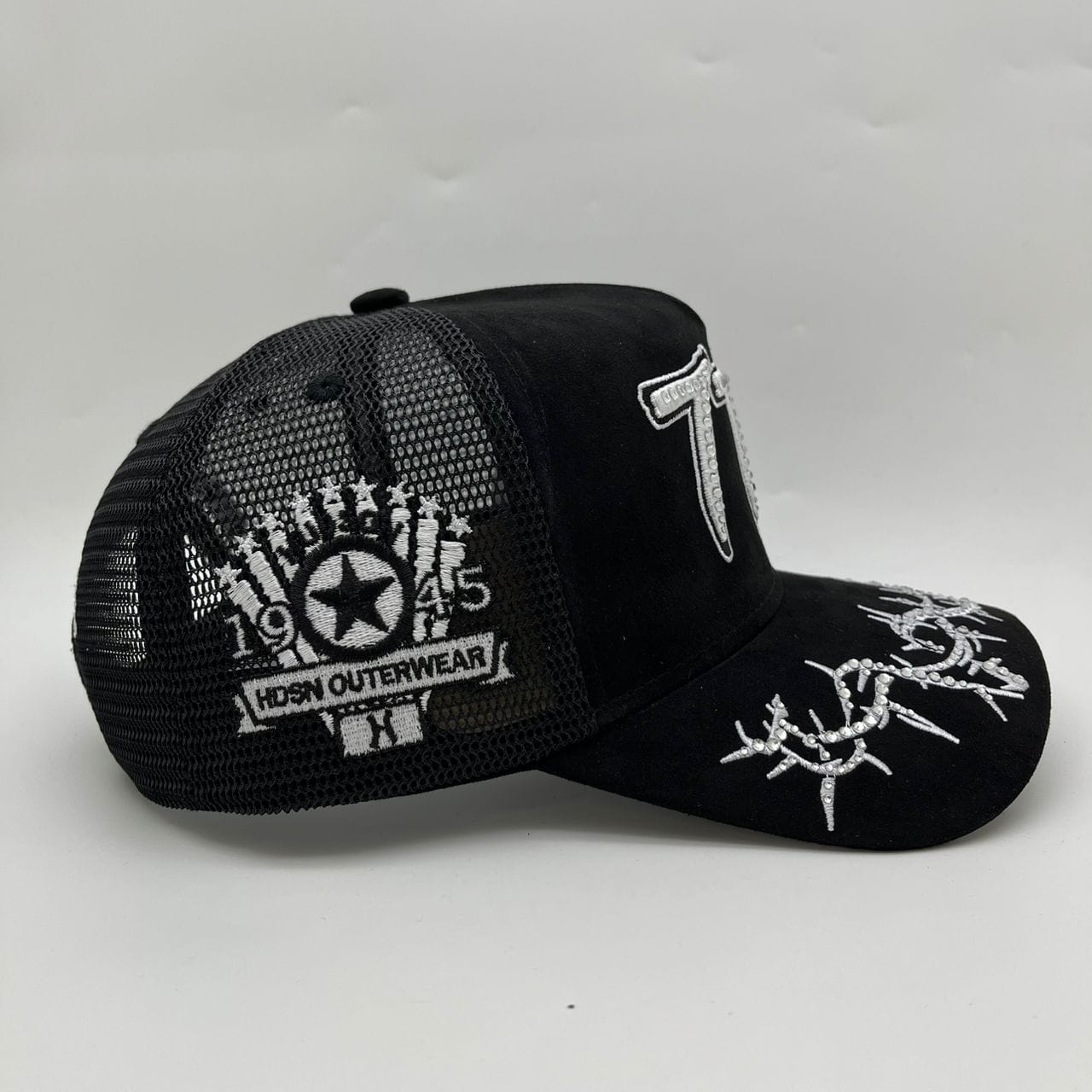 Hudson Outerwear V2 Diamond Suede Trucker Hat with mesh back and adjustable strap, featuring diamond-patterned suede fabric.