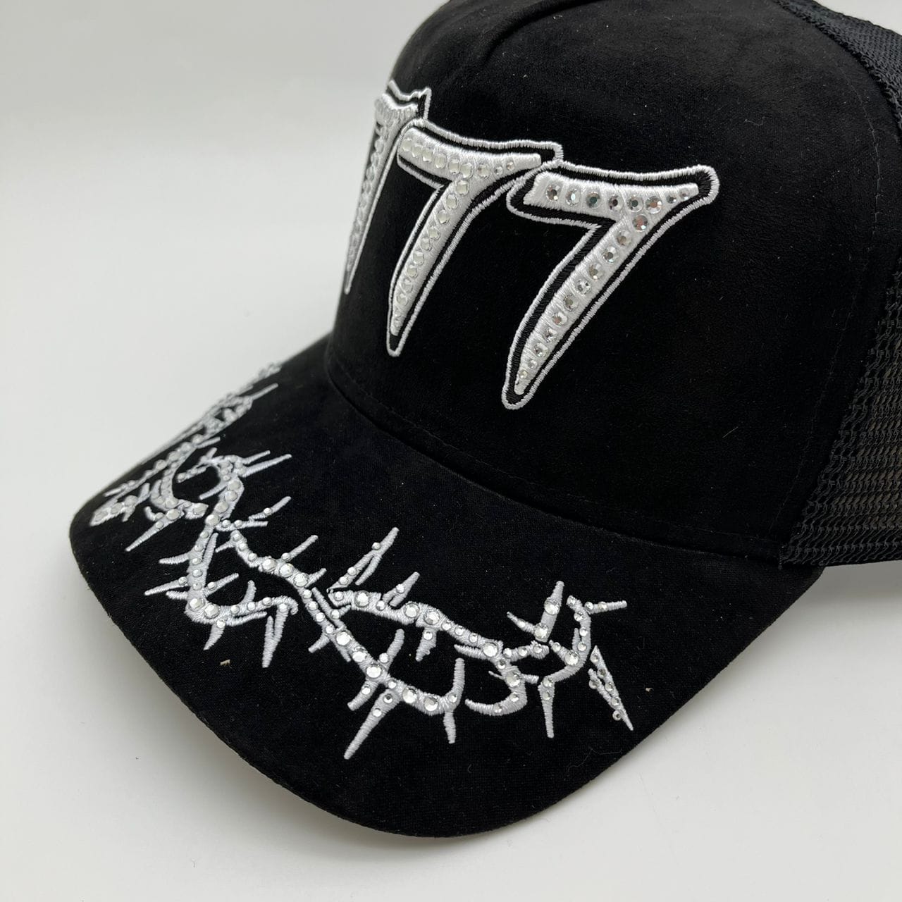 Hudson Outerwear V2 Diamond Suede Trucker Hat featuring a classic trucker style with diamond-patterned suede material.