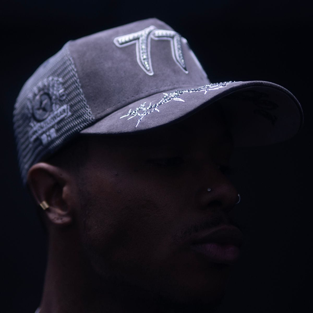 Hudson Outerwear V2 Diamond Suede Trucker Hat with curved brim and adjustable snapback, in diamond-patterned suede fabric.