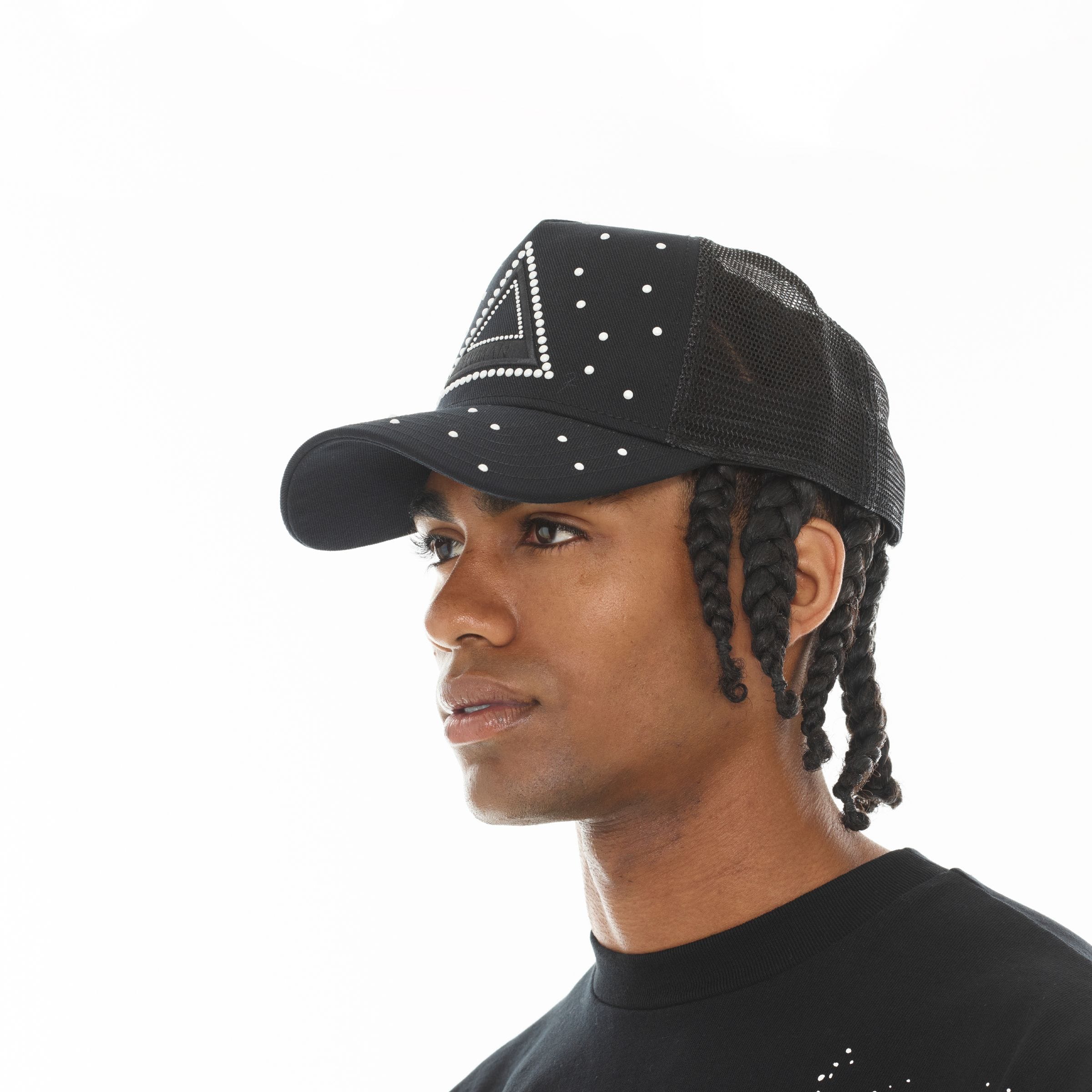Hvman triangle logo mesh trucker hat with breathable mesh panels and adjustable snapback closure.