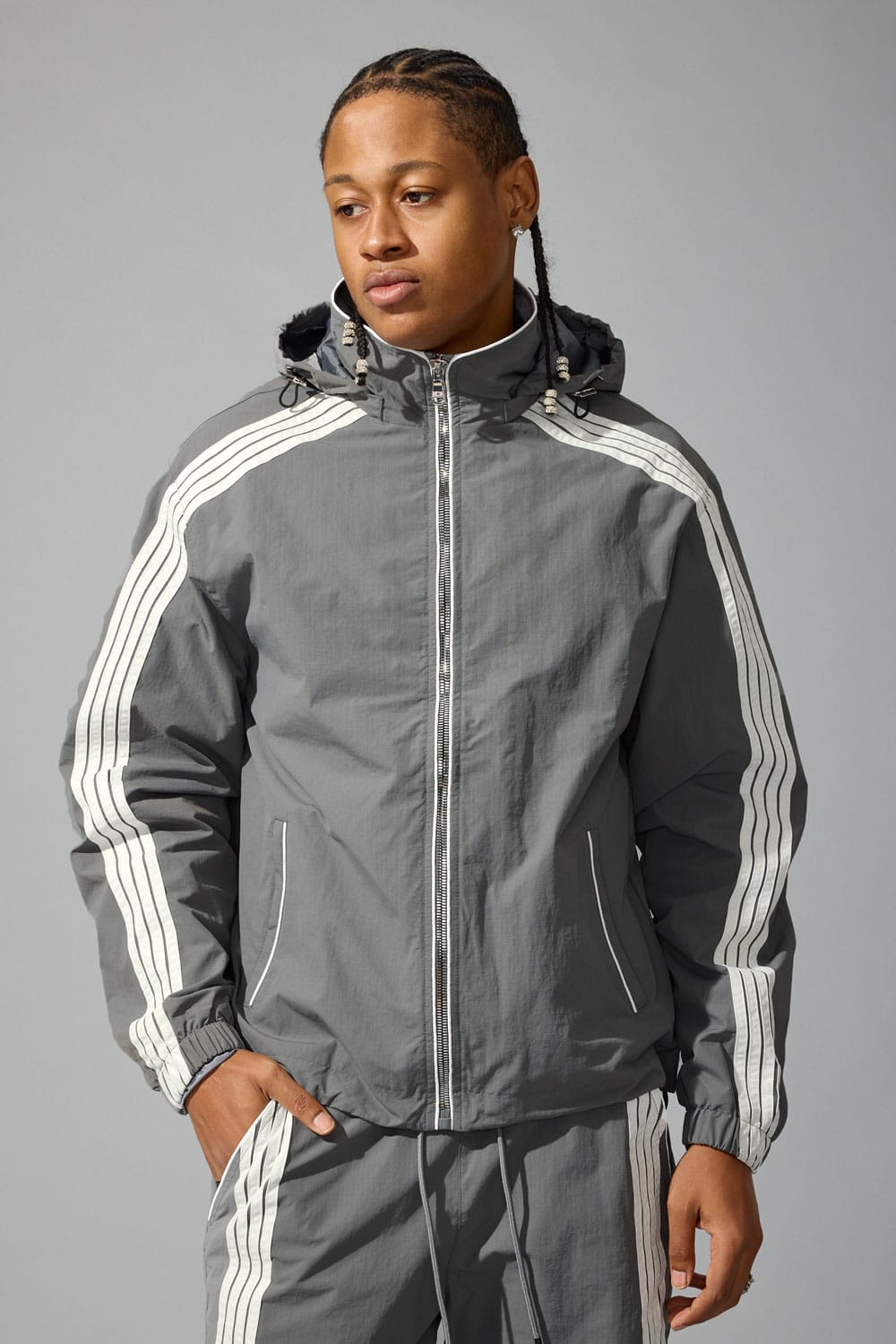 Jordan Craig track jacket, stylish athletic jacket with logo detail, black with white accents, perfect for casual and sportswear.
