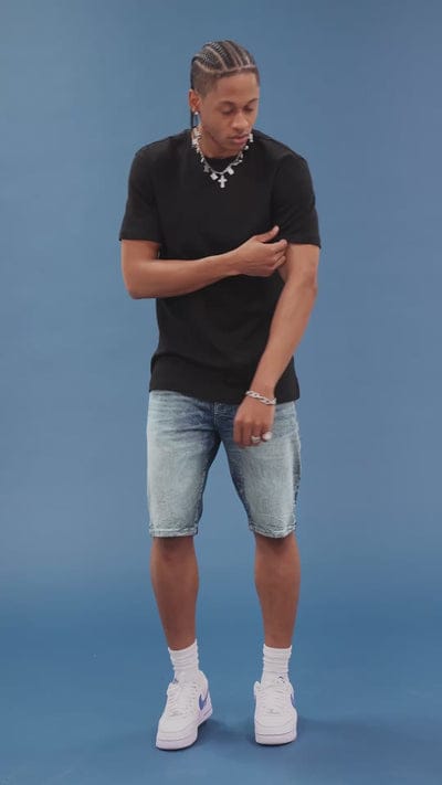 Jordan Craig OG Cascade Jean Shorts displayed on a model, featuring distressed denim and a casual fit.