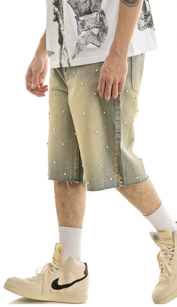 KDNK rhinestone embellished denim shorts with vintage wash, featuring decorative rhinestones and distressed details.