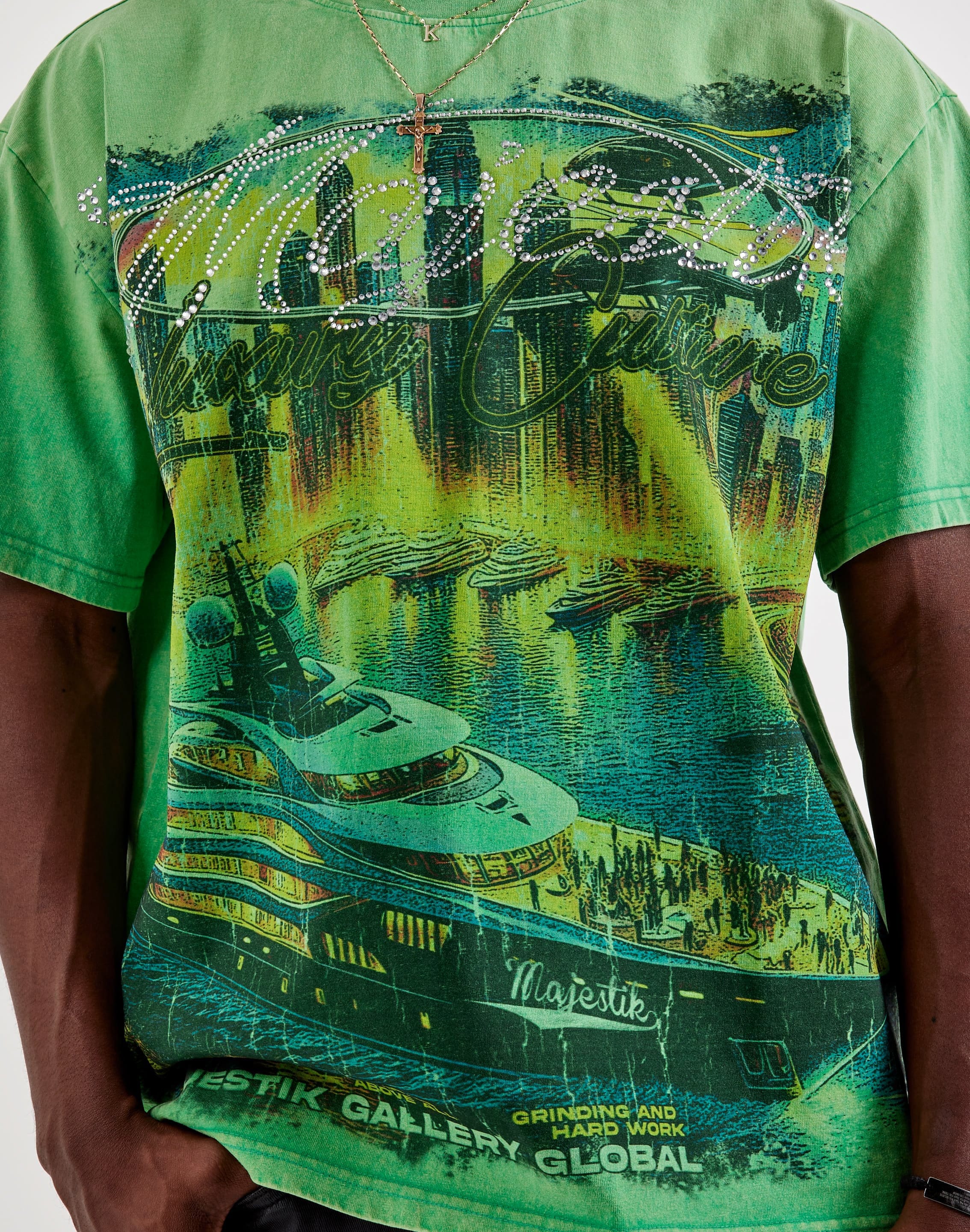 Majestik Tour Tee T-shirt featuring a colorful graphic design, displayed on a hanger with a plain background.