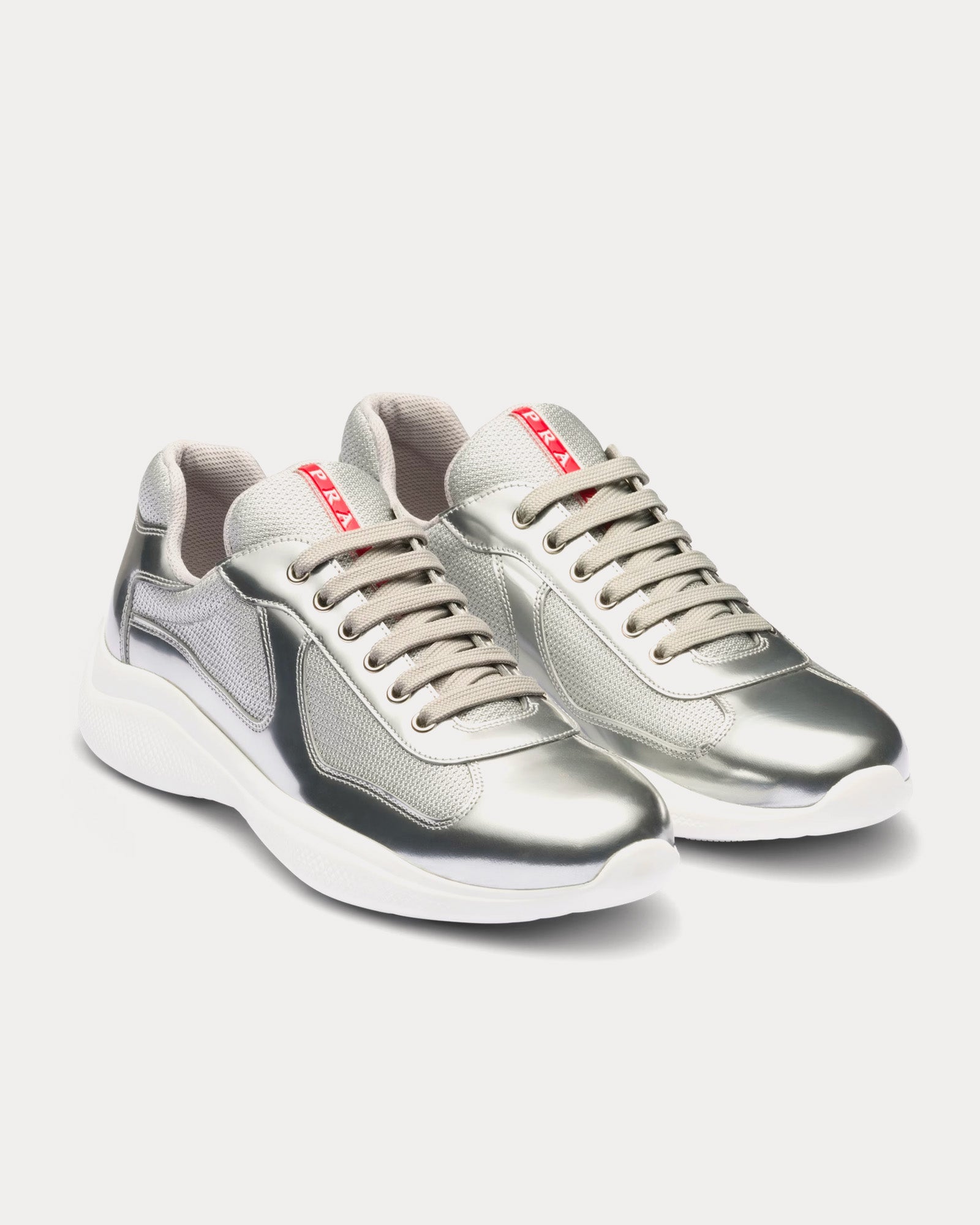 Prada America's Cup silver sneakers featuring metallic leather and bike fabric design, showcasing a stylish athletic look.