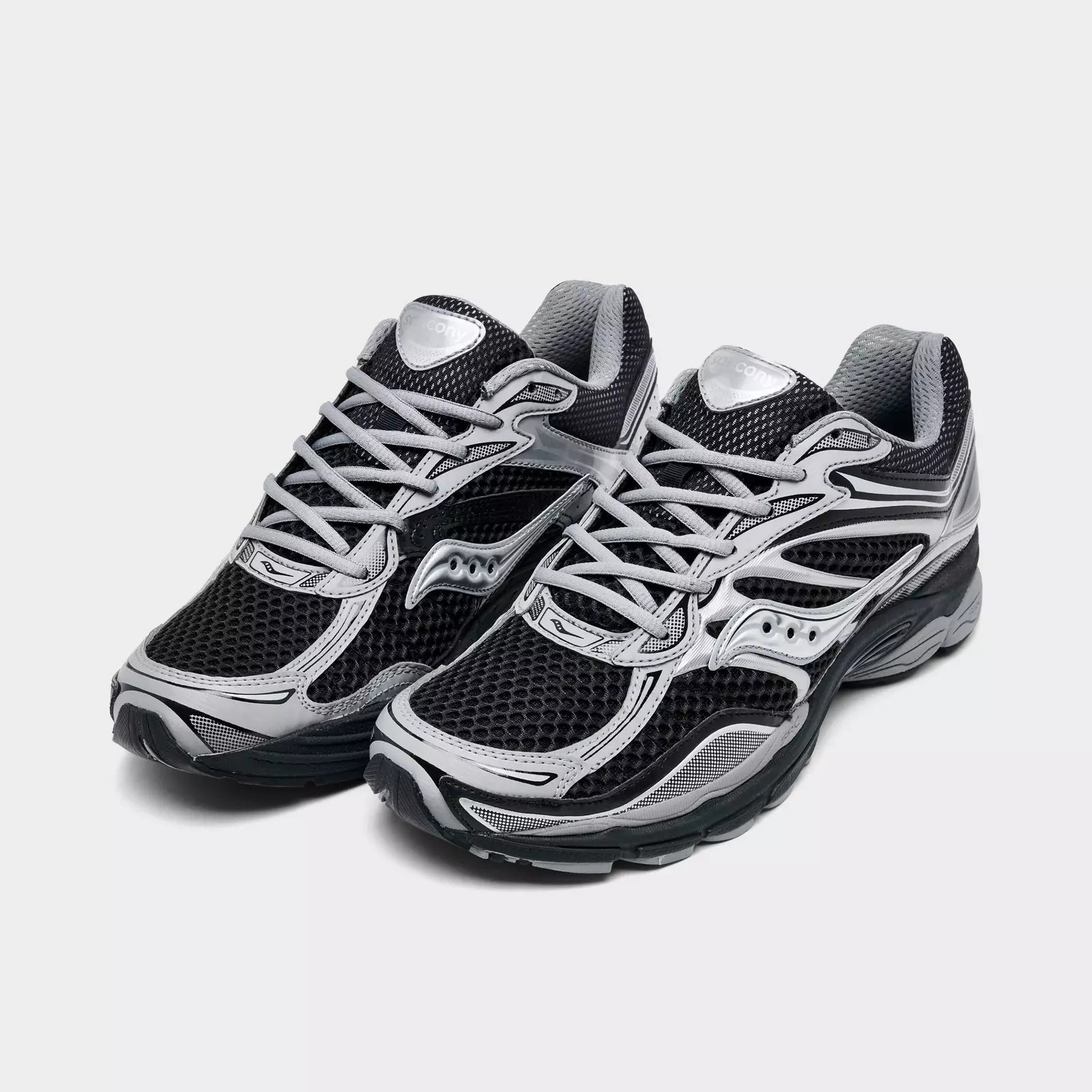 Men's Saucony ProGrid Omni 9 sneakers in black with metallic silver accents, featuring a sleek design and athletic sole.