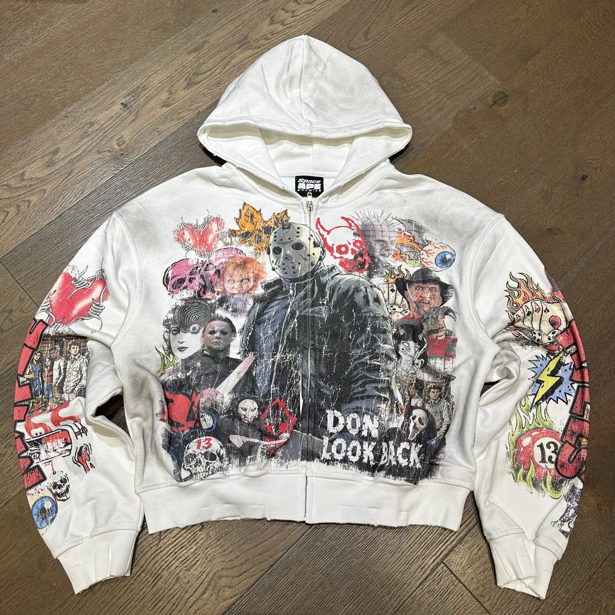 Friends Forever zip-up hoodie by Space Ape Studios, featuring a comfortable design and graphic print, shown on a model.